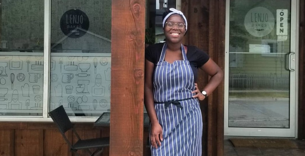 Photo of woman standing in front of a store