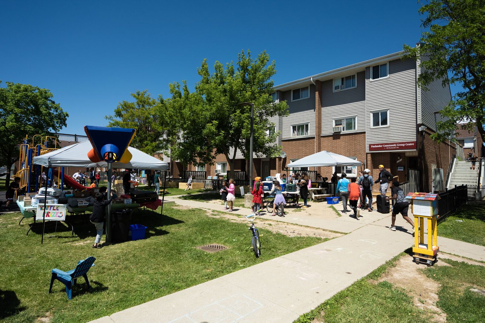 People gathered for a porch party in a condo complex
