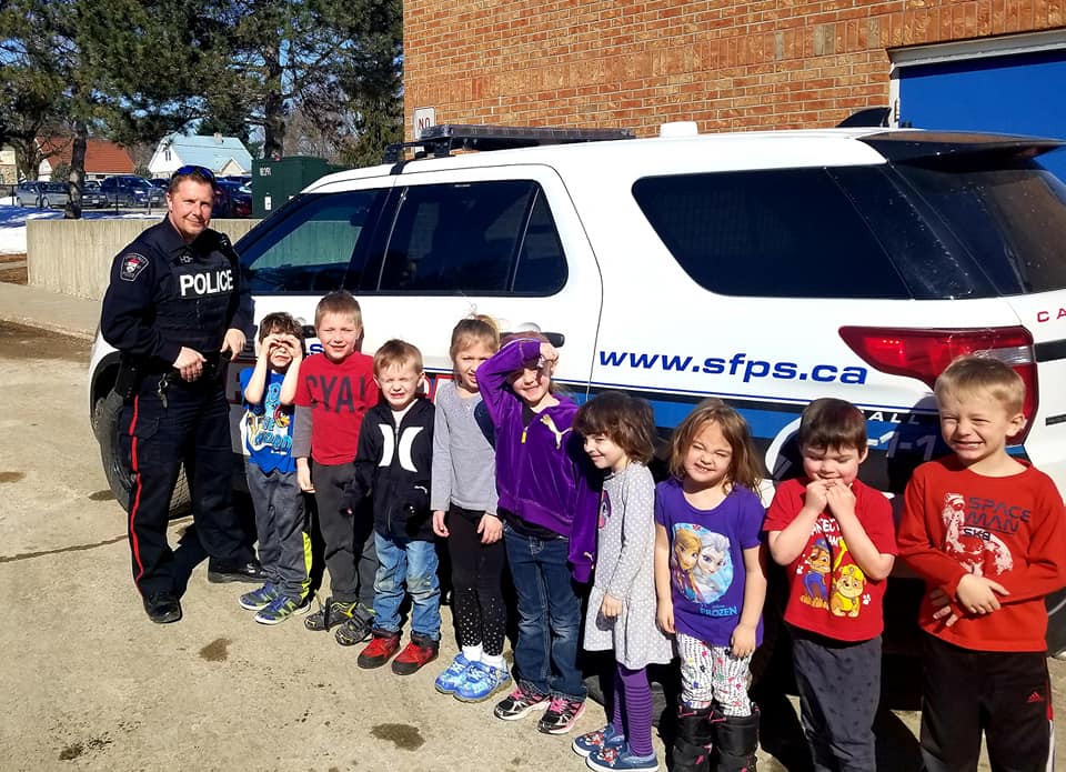 CSO with cruiser and students CSO with cruiser and students