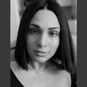 Charisa Gerow Black and white photo of a woman looking at the camera