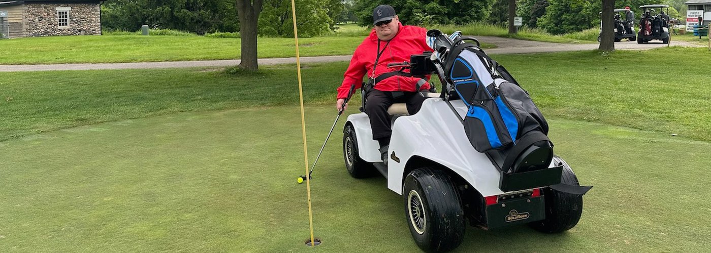 Person using accessible golf card