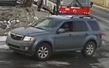 Blue-grey vehicle left view Carling B&E